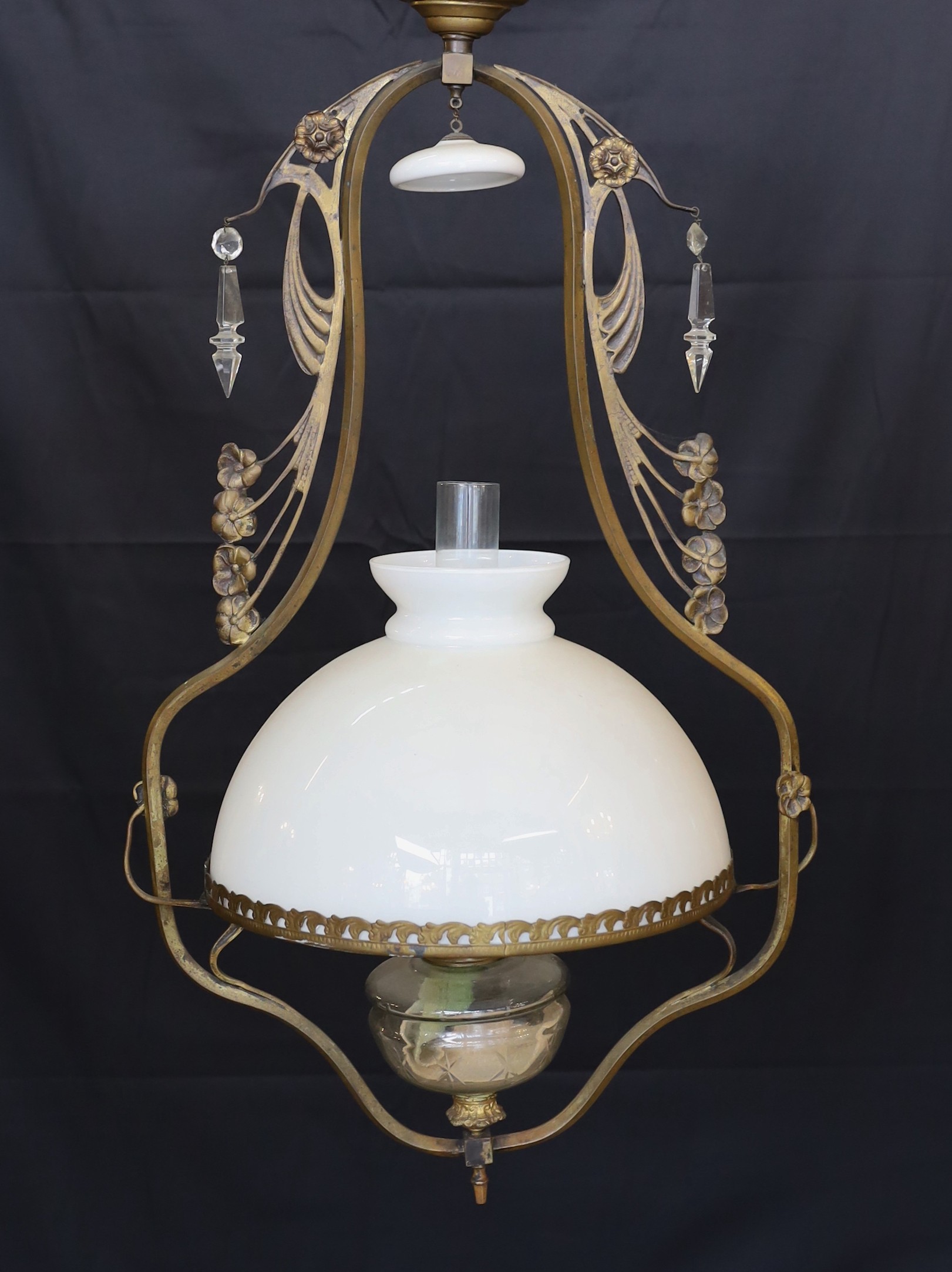 A late 19th century French bronze and cut glass hanging oil lamp with opaque glass shade, drop 90cm.
